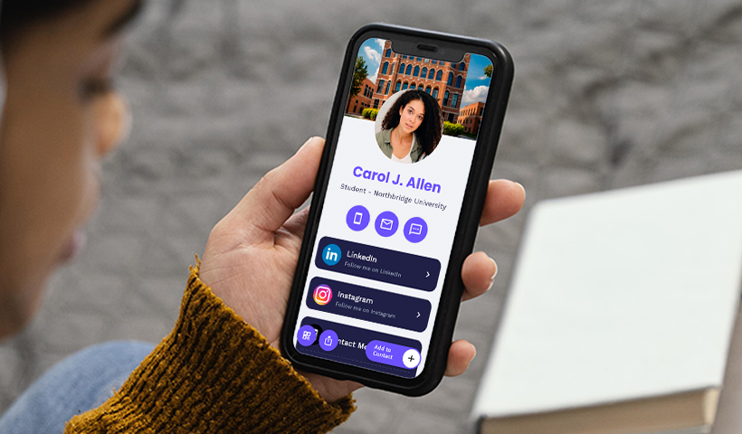 Student holding a phone displaying a digital business card with name, photo, and social links.