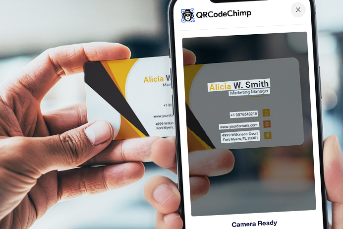 Phone scanning a physical business card to capture contact details